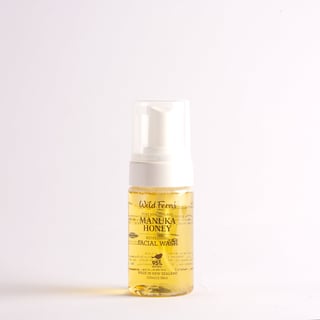 Bottle of Wild Ferns Manuka Honey facial wash with foaming pump dispenser on white background