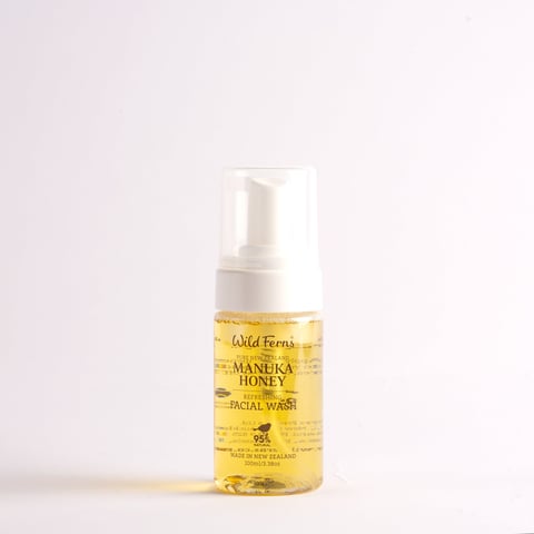 Bottle of Wild Ferns Manuka Honey facial wash with foaming pump dispenser on white background