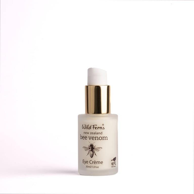 Wild Ferns bee venom eye cream bottle with gold pump dispenser on white background